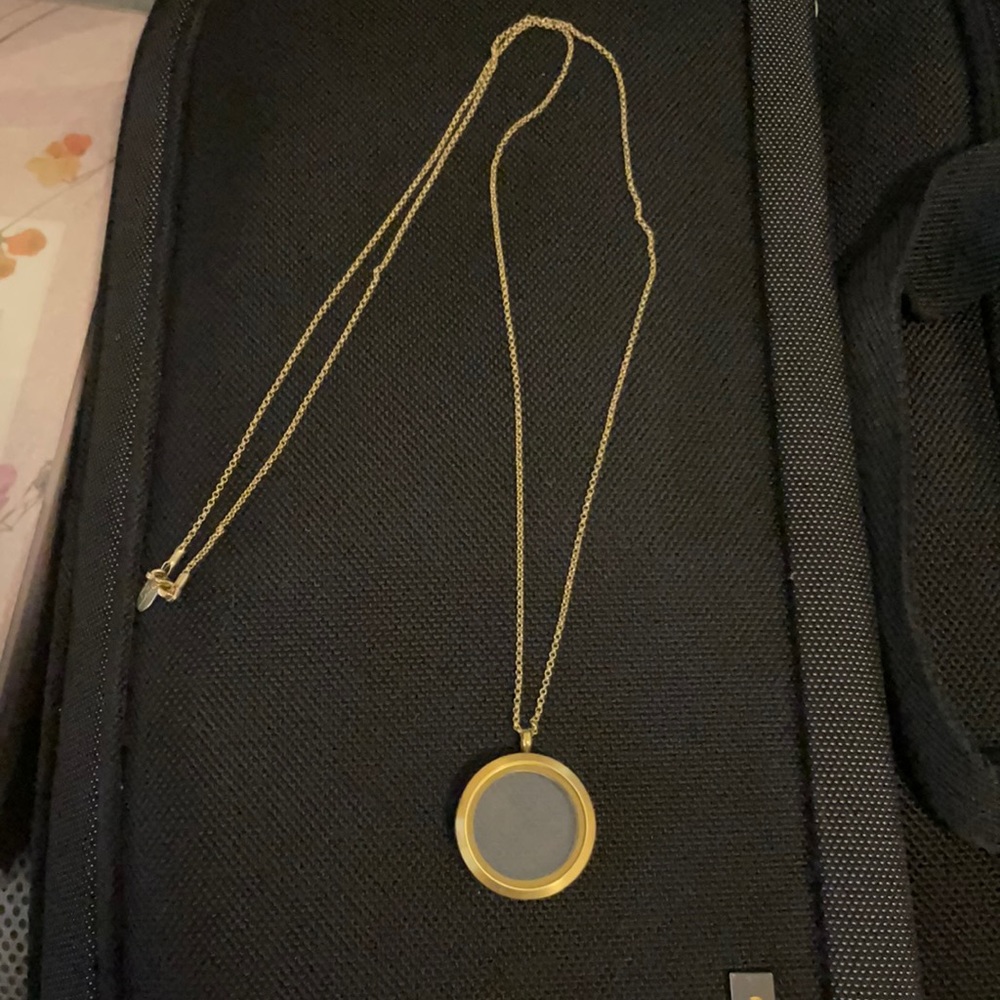 Origami owl.  Large gold locket and chain.